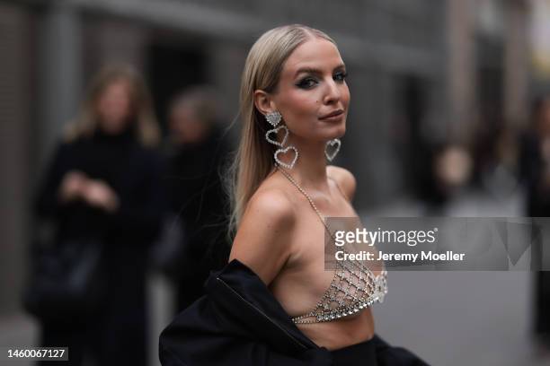 Leonie Hanne seen wearing a sparkling bra and matching bag, a long black skirt, a bomber jacket and black heels before the Elie Saab show on January...