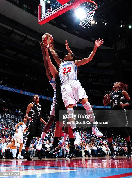 Armintie Price of the Atlanta Dream grabs a rebound against the San Antonio Silver Stars at Philips Arena on June 8, 2012 in Atlanta, Georgia. NOTE...