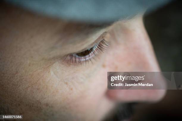 crazy close up portrait photos of man in suit on lighted white background, experimental - big nose - fotografias e filmes do acervo