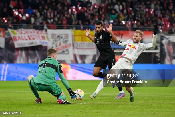 Konrad Laimer of RB Leipzig has a shot saved by Florian Mueller of VfB Stuttgart during the Bundesliga match between RB Leipzig and VfB Stuttgart at...