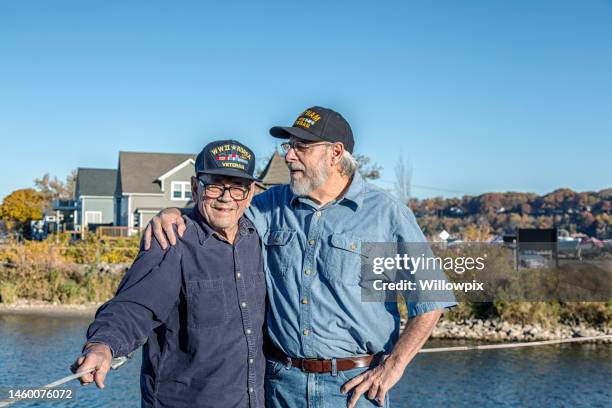 usa vietnam war veteran teasing older wwii military veteran - world war 2 symbols stock pictures, royalty-free photos & images