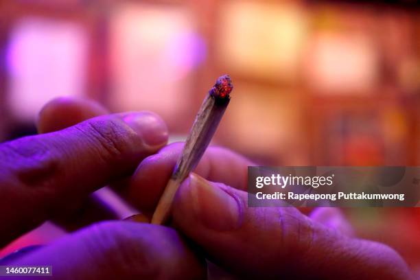 friends sharing a marijuana joint - smoking weed stock pictures, royalty-free photos & images