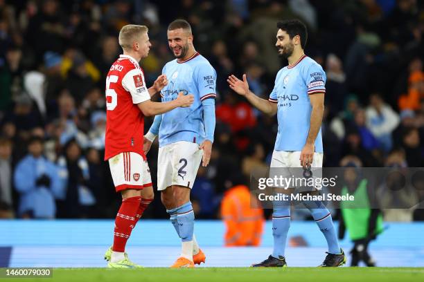 Oleksandr Zinchenko of Arsenal shakes hands with Kyle Walker and Ilkay Gundogan of Manchester City after the Emirates FA Cup Fourth Round match...