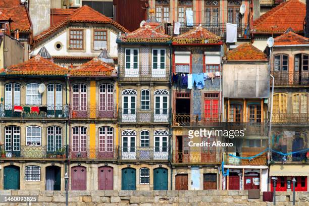 urban landscape of the historic center of porto, northern portugal. traditional colored stone houses in ribeira, on the bank of the douro river. tourist attraction and vacation destination. - anaheim california stock-fotos und bilder