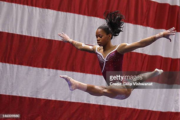 Gabrielle Douglas competes on the balance beam during the Senior Women's competition on day two of the Visa Championships at Chaifetz Arena on June...