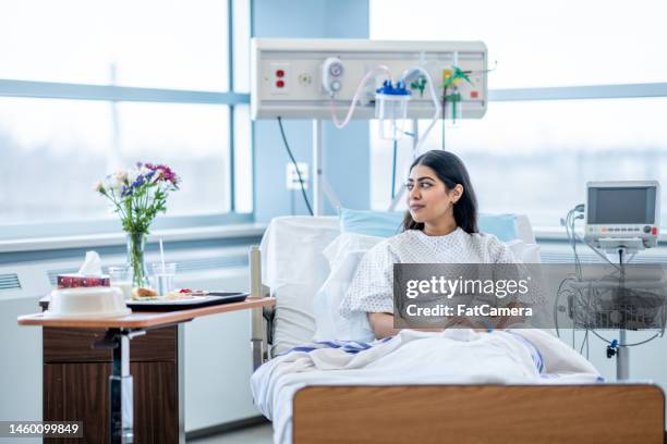 woman in the hospital - patient in bed stockfoto's en -beelden