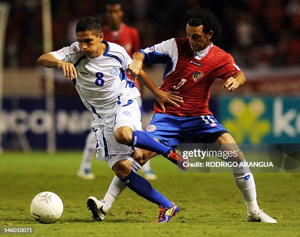 Costa Rica's Michael Barrantes vies for the ball with El Salvador's Osael Romero during their FIFA World Cup Brazil 2014 North, Central America and...