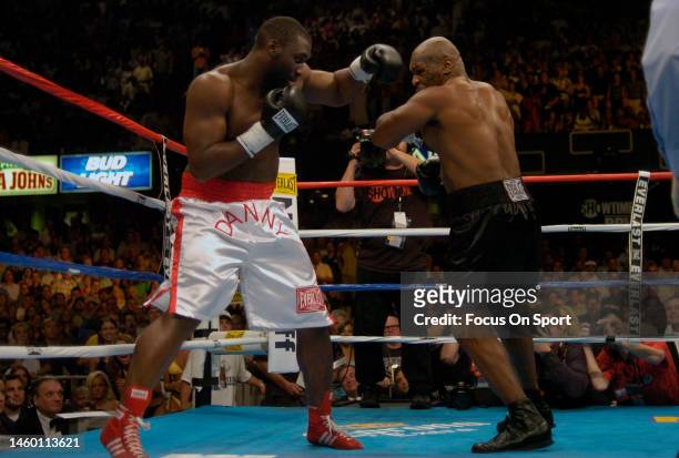 Danny Williams, white trunks, and Mike Tyson, black trunks fights each other during a heavyweight match on July 30, 2004 at Freedom Hall in...
