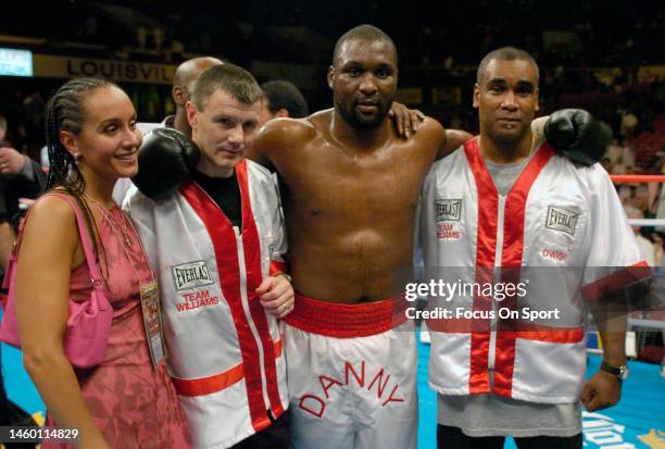 Danny Williams celebrates with his trainers after he knocked out Mike Tyson in the fourth round during a heavyweight match on July 30, 2004 at...