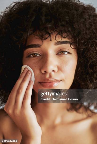 black woman, beauty portrait and cotton skincare for cleaning with dermatology detox cosmetics. face of a wellness model in studio for skin glow, natural hair and self care facial cosmetic mockup - facial cleanser stockfoto's en -beelden
