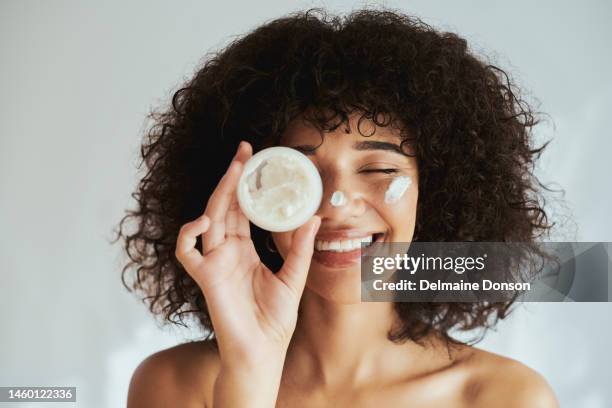 cream, lotion and face of black woman with beauty product, skincare cosmetics and advertising isolated on white wall. beautiful skin care person with container, moisturizer and skin care mockup - skin care 個照片及圖片檔