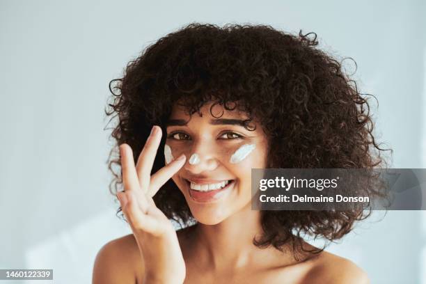 cream, moisturizer and face, skincare woman in beauty or collagen promotion on white wall background. facial, cosmetics and portrait of young and happy person or model with lotion or sunscreen - clay mask face woman stock pictures, royalty-free photos & images