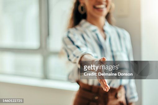 Open handshake, office and woman with welcome, kindness and smile for meeting, respect and friendly. Black woman, hr expert and hand shake for hiring, human resources or recruitment with happiness