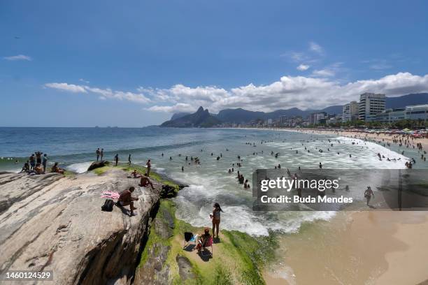 Tourists and Locals Enjoy Summer at Arpoador beach on January 27, 2023 in Rio de Janeiro, Brazil.