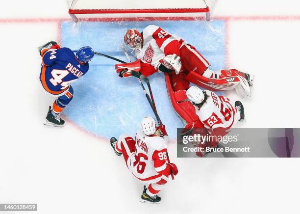 Magnus Hellberg of the Detroit Red Wings makes a third period save on Jean-Gabriel Pageau of the New York Islanders at the UBS Arena on January 27,...