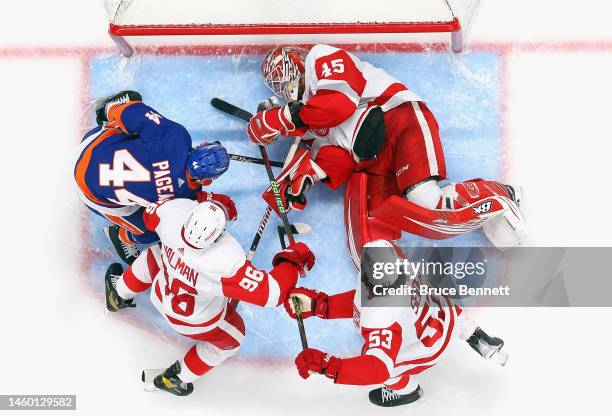 Magnus Hellberg of the Detroit Red Wings makes a third period save on Jean-Gabriel Pageau of the New York Islanders at the UBS Arena on January 27,...