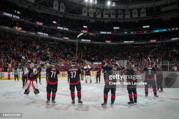 The Carolina Hurricanes celebrate with the Storm Surge after defeating the San Jose Sharks at PNC Arena on January 27, 2023 in Raleigh, North...
