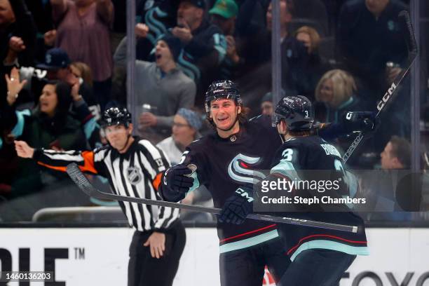 John Hayden of the Seattle Kraken celebrates his goal with Will Borgen against the Calgary Flames during the first period at Climate Pledge Arena on...