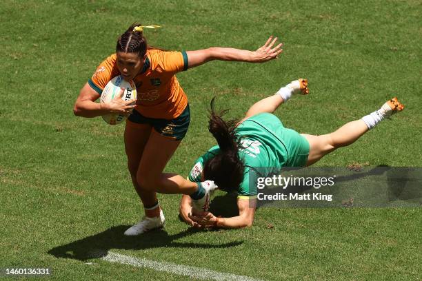 Charlotte Caslick of Australia is tackled during the 2023 Sydney Sevens match between Australia and Ireland at Allianz Stadium on January 28, 2023 in...