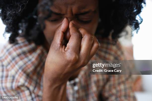 woman suffers from sinus headache - sinus headache stock pictures, royalty-free photos & images