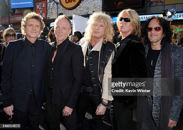 Musicians Rick Allen, Phill Collen, Rick Savage, Joe Elliott and Vivian Campbell of Def Leppard arrive at the premiere of Warner Bros. Pictures'...