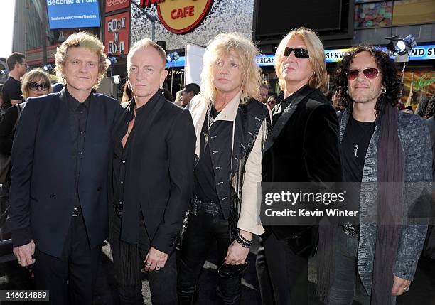 Musicians Rick Allen, Phill Collen, Rick Savage, Joe Elliott and Vivian Campbell of Def Leppard arrive at the premiere of Warner Bros. Pictures'...