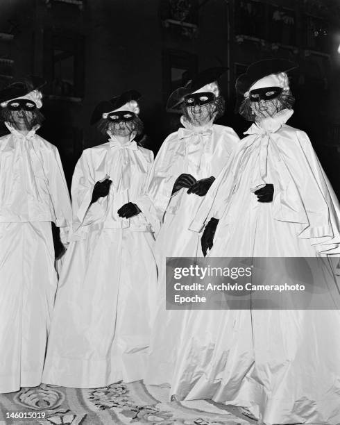 Begum Om Habibeh Aga Khan with fellow guests at a masked costume ball at the Palazzo Labia, Venice, 3rd September 1951. Named 'Le Bal Oriental' and...