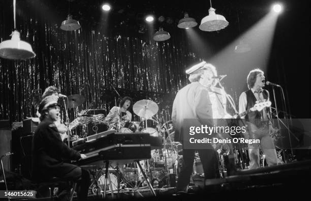 Singers Tom Robinson, Peter Gabriel and Elton John performing at the Hammersmith Odeon in London, during the Rob & Gab Xmas charity show, 24th...