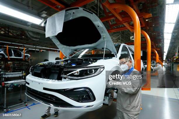 Car bodies are assembled at the Qingdao branch of FAW-Volkswagen Automobile Co., Ltd, a joint venture between FAW Group and Volkswagen Group, on...