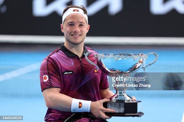 Alfie Hewett of Great Britain poses with the championship trophy after winning the Men's Wheelchair Singles Final against Tokito Oda of Japan during...