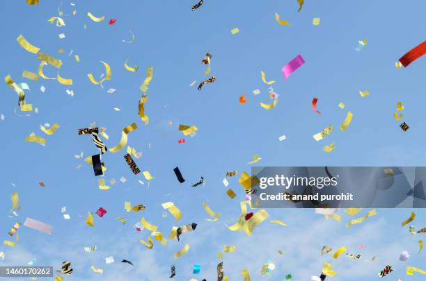 celebration paper ribbons confetti blast colourful party background - birthday streamers stock-fotos und bilder