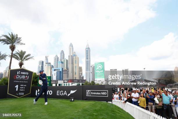 Rory McIlroy of Northern Ireland tees off on the 1st hole during the continuation of Round Two on Day Three of the Hero Dubai Desert Classic at...