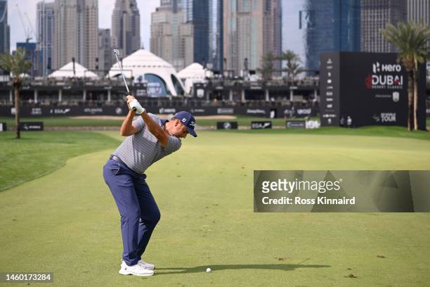 Richard Bland of England plays their second shot on the 18th hole during the continuation of Round Two on Day Three of the Hero Dubai Desert Classic...