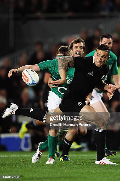 Sonny Bill Williams of the All Blacks offloads during the International Test Match between the New Zealand All Blacks and Ireland at Eden Park on...