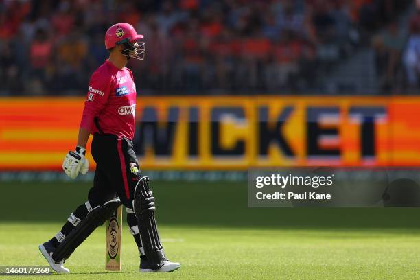 Josh Philippe of the Sixers walks from the field after being dismissed by Jason Behrendorff of the Scorchers during the Men's Big Bash League match...
