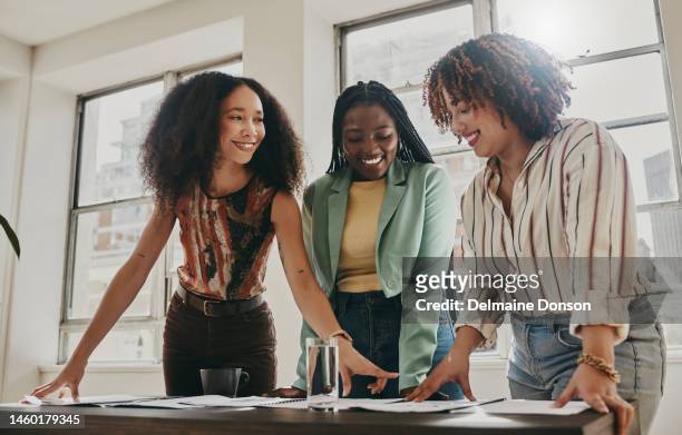 teamwork, collaboration and planning black women with documents, paperwork or design strategy in office. business startup, gender equality and marketing ideas of diversity people in workspace meeting - women working stockfoto's en -beelden