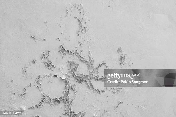 abstract old white concrete wall with peeling paint. - cracked plaster stock pictures, royalty-free photos & images