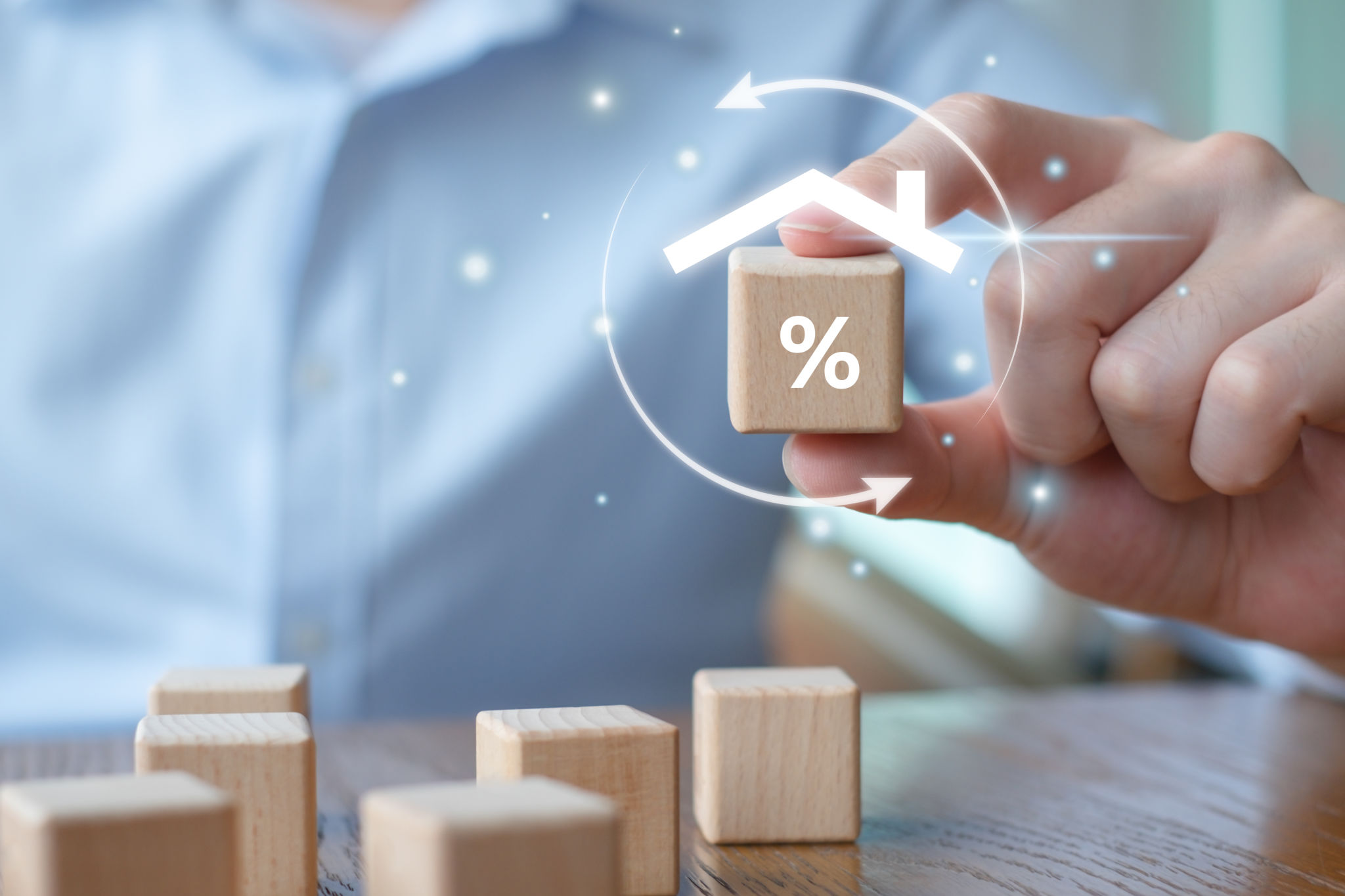 Refinance to reduce the interest of home loan. Hand holding percentage sign with roof house. Mortgage, loan, repayments, credit limit, interest rate, business and financial concept. Refinance to reduce the interest of home loan. Hand holding percentage sign with roof house. Mortgage, loan, repayments, credit limit, interest rate, business and financial concept.