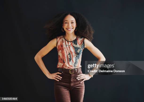 confident, happy and beautiful black woman isolated on dark background success, creative and trendy mockup. hands on hips, proud and fashion person portrait for female empowerment on mock up space - hand on hip stock pictures, royalty-free photos & images