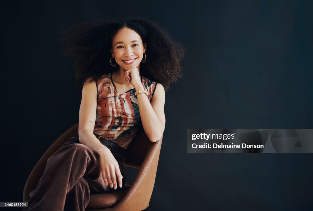Sitting, beautiful and confident black woman isolated on dark background for success, hr vision and mockup space. Human Resources, smart and intelligent person in a portrait for empowerment mock up