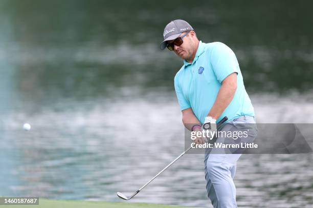 George Coetzee of South Africa chips onto the 9th green during the continuation of Round Two on Day Three of the Hero Dubai Desert Classic at...