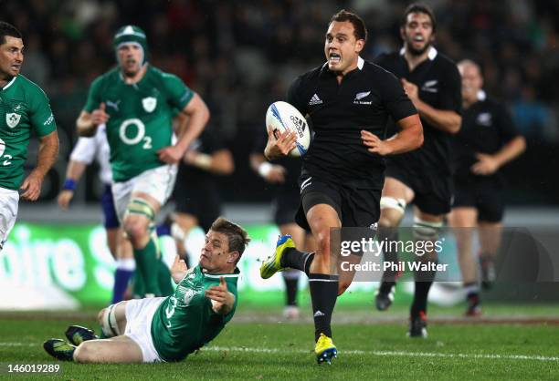 Israel Dagg of the All Blacks breaks through the tackle of Brian O'Driscoll of Ireland during the International Test Match between the New Zealand...