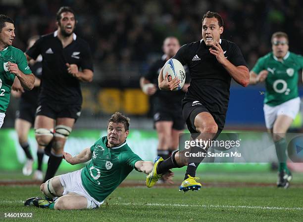 Brian O'Driscoll of Ireland misses the tackle of Israel Dagg of the All Blacks during the International Test Match between the New Zealand All Blacks...