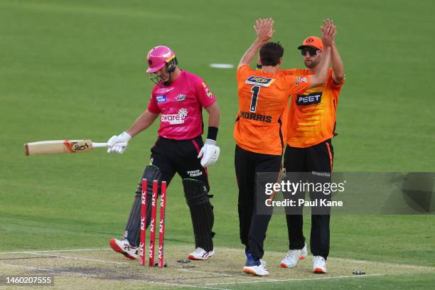 Lance Morris and Andrew Tye of the Scorchers celebrate the run-out of Dan Christian of the Sixers during the Men's Big Bash League match between the...