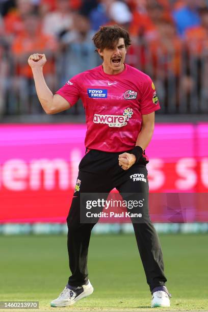 Sean Abbott of the Sixers celebrates the wicket of Aaron Hardie of the Scorchers during the Men's Big Bash League match between the Perth Scorchers...