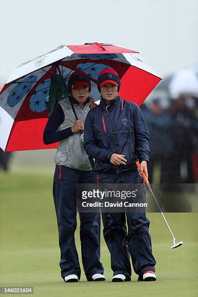 Austin Ernst of the United States with her partner Brooke Pancake on the green at the 16th hole during the morning foursomes matches in the 37th...