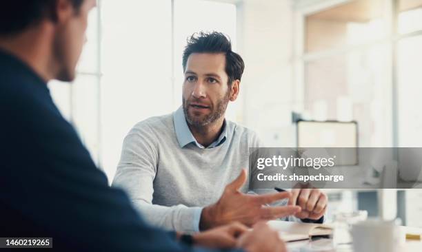 planning, target or business man in meeting with notebook for strategy, analytics research or data analysis. focus, teamwork or manager for creative idea, company growth or schedule agenda review - feedback stockfoto's en -beelden