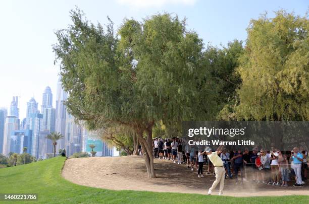 Miguel Angel Jimenez of Spain plays their second shot on the 13th hole during the continuation of Round Two on Day Three of the Hero Dubai Desert...
