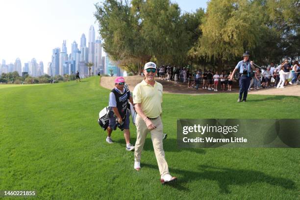 Miguel Angel Jimenez of Spain smiles to camera after their second shot on the 13th hole during the continuation of Round Two on Day Three of the Hero...