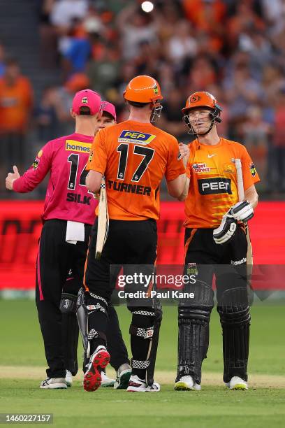Ashton Turner and Cameron Bancroft of the Scorchers celebrate winning the Men's Big Bash League match between the Perth Scorchers and the Sydney...